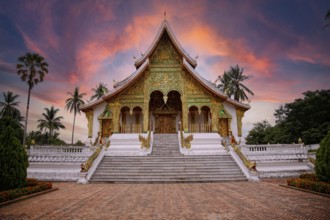 Lovely sunset at a lovely temple in Luang Prabang in summer, Laos, Asia