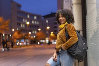 Portrait of black ethnic girl smiling early in the morning going to college on back to school
