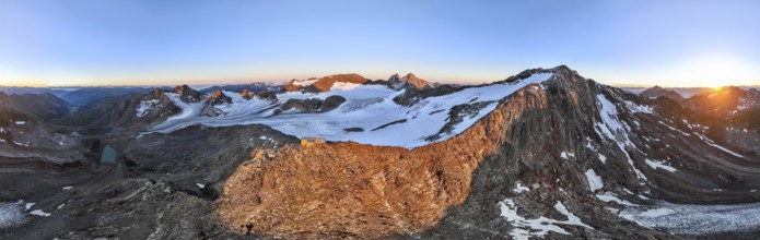 DefaultAtmospheric sunrise in a picturesque mountain landscape, alpenglow, aerial view, mountain