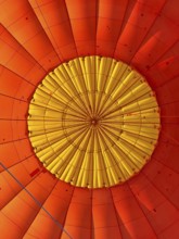 Hot air balloon inside view, top opens to release warm air before landing. Hot air balloon ride