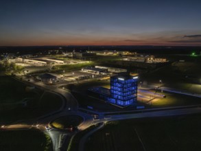 Illuminated industrial building at night in a rural setting, Nagold, Black Forest, Germany, Europe