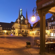 Market square with atmospherically illuminated town hall in the evening, Wernigerode, Harz,