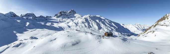 Alpine panorama, aerial view with Kesch hut, Alpine Club hut of the SAC in winter, Albula Alps,