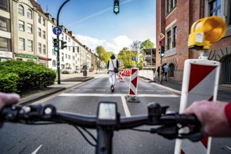 Cycling in the city, city centre road, roadworks, no cycle path, two-lane traffic in both