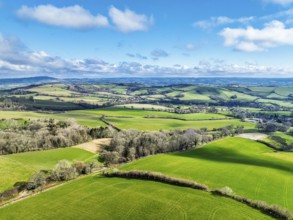 Farms over Road A35 from a drone, Morcombelake Village, Bridport, Dorset, England, United Kingdom,