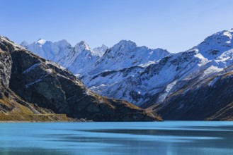 Moiry reservoir, snow-covered mountain peaks behind, near Grimentz, Val d'Anniviers, Valais Alps,