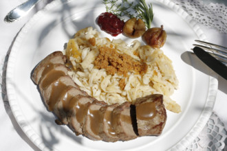 Swabian cuisine, roast venison with spaetzle, chestnuts and breadcrumbs, breadcrumbs, saddle of