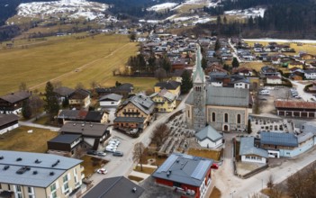Drone image, residential buildings, view of village with parish church, Niedernsill, Pinzgau,