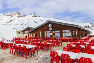 Free tables and chairs on the terrace of the Bendolla mountain restaurant, Grimentz, Val