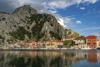 The old town centre of Omis on the river Cetina with the ruins of the Mirabella or Peovica