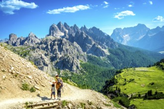 Tourists enjoying breathtaking views while hiking on a scenic trail in tre cime di lavaredo,