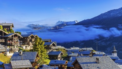Roofs covered with hoarfrost, fog rising, Grimentz, Val d'Anniviers, Valais Alps, Canton Valais,