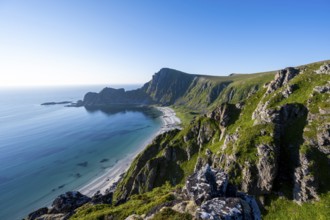 View of coastal landscape, cliffs with peak Måtind or Måtinden, Høyvika beach and sea, hike to the