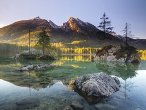 Hintersee in the morning in the first sunlight, behind the peaks of the Hochkalter, Berchtesgaden