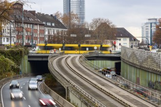 Motorway A40, Ruhrschnellweg, skyline of the city centre of Essen, exit Essen-Huttrop, track bus