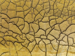 Mineral-rich cracked earth at the bank of the Rio Tinto (Red river), aerial view, drone shot,
