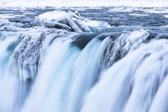 Godafoss waterfall, icy and snowy rock face, Northern Iceland Eyestra, Iceland, Europe