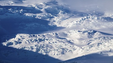 Light and shadow over the snow-covered glacier Oraefajökull, Sudurland, Iceland, Europe