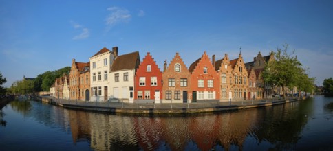 Typical Belgian cityscape Europe tourism concept, panorama of canal and old houses on sunset.