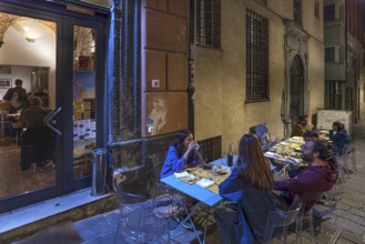 Guests sitting in the outdoor area of the Trattoria delle Grazie, Via delle Grazie, 48, Old Town,