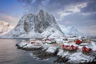 Famous tourist attraction Hamnoy fishing village on Lofoten Islands, Norway with red rorbu houses.