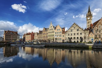 Europe Belgium medieval town travel background, Ghent canal and Graslei street on sunset. Ghent,