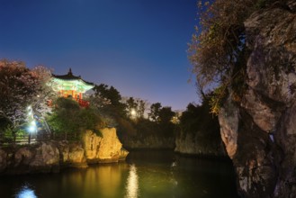 Scenic Yongyeon Pond with Yongyeon Pavilion illuminated at night, Jeju islands, South Korea, Asia