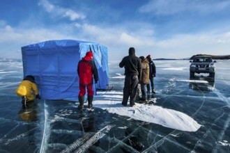 Group of scuba divers before a dive under ice, Lake Baikal, Olkhon Island, Pribaikalsky National