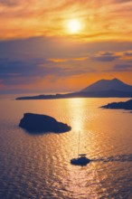 Aegean Sea with Greek islands view on sunset with yacht in sea. Cape Sounion, Greece, Europe