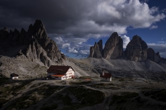 Stormy atmosphere, view of the Three Peaks Hut, chapel, Paternkofel, Three Peaks, South Tyrol,