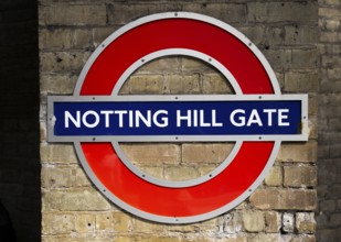 Sign on brick wall, Notting Hill Gate underground station, SLondon, England, Great Britain