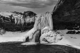 Frozen waterfall, Skutafoss, black and white photo, Sudausturland, Iceland, Europe