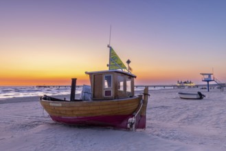 Traditional wooden fishing boat on the beach along the Baltic Sea at Ahlbeck, Heringsdorf on the