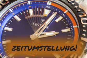 Symbolic image time change, winter time: close-up of a wristwatch with the inscription TIME CHANGE