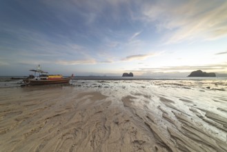 Structures in the sand, sunrise at low tide on the beach of Koh Ngai Island, Andaman Sea, Satun