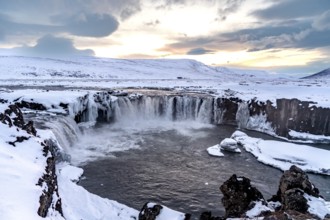 Beautiful landscape at Godafoss waterfall at sunset in winter, Iceland, Europe