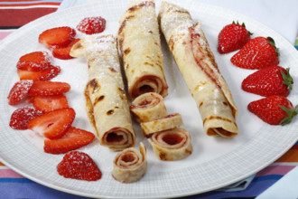 Swabian cuisine, filled pancakes, Flädle with strawberry jam and icing sugar, Gsälz, fresh