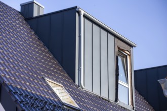 Extension of living space by installing a dormer window: Newly installed dormer window on a newly