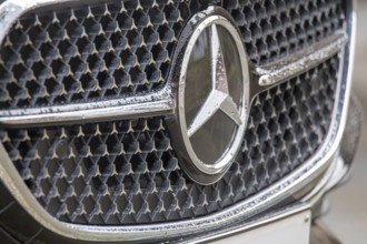 Close-up of the Mercedes star on the radiator grille