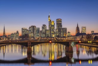 The lights of Frankfurt's banking skyline glow in the evening after sunset, Frankfurt am Main,