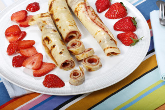 Swabian cuisine, filled pancakes, Flädle with strawberry jam, Gsälz, fresh strawberries, sweet,
