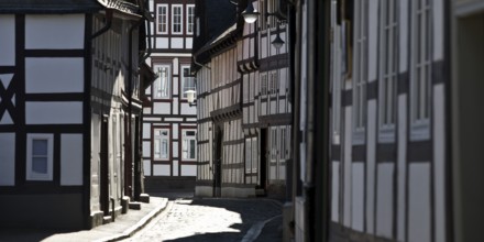 Narrow alley with half-timbered houses and cobblestones in the old town, UNESCO World Heritage