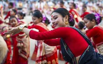 Participants with instructors dance on the final day of a Bihu dance workshop ahead of Rongali Bihu