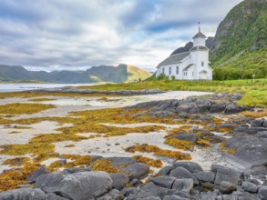Gimsøy church with beach and seaweed, Gimsøy, Lofoten, Norway, Europe