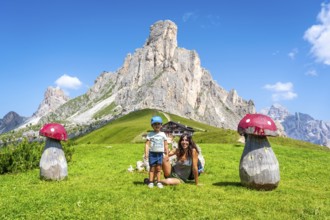 Mother and son enjoying a summer vacation in the stunning italian dolomites, surrounded by the