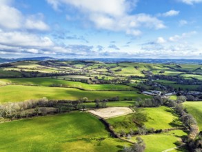 Farms over Morcombelake Village from a drone, Bridport, Dorset, England, United Kingdom, Europe