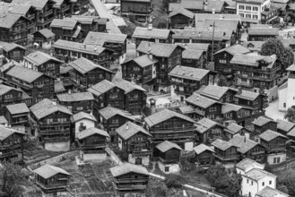 Old wooden houses in the historic village centre, black and white photo, aerial view, Grimentz, Val