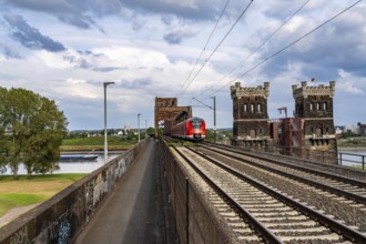 The railway bridge Duisburg-Hochfeld-Rheinhausen, over the Rhine, regional trains and many goods