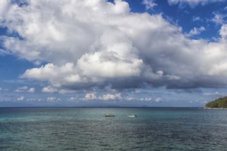Tropical sea and sky with clouds in the marine reserve. Malaysia