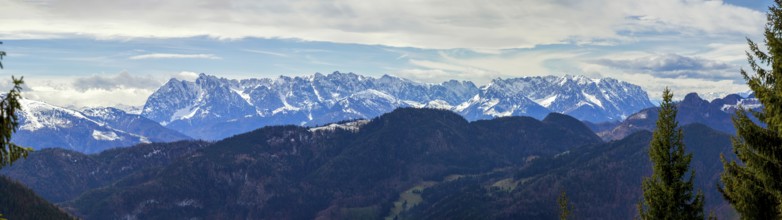 Panoramic view of the snow-covered Alps photographed from the Hochgern summit, at Lake Chiemsee in